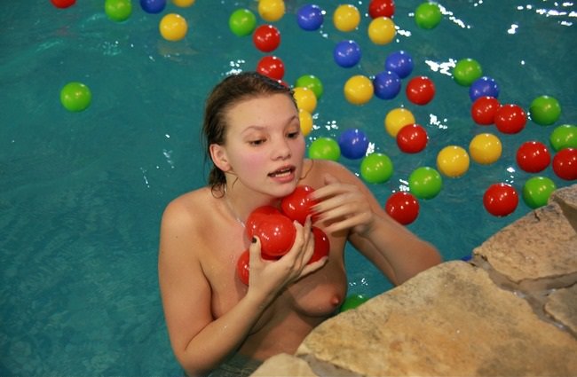 In the water park naked young and adult nudists photo