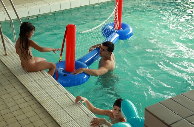 Men and women nudists in the pool